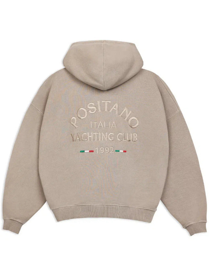 Beige hoodie with 'POSITANO ITALIA YACHTING CLUB' text and logo on the back against a white background